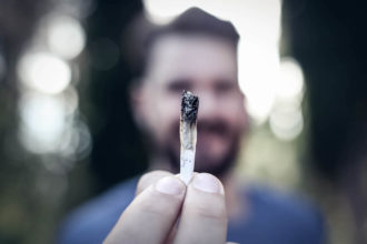 Man holding joint