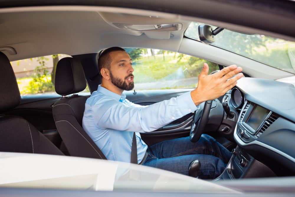 frustrated man who in involved in an accident with an uninsured motorist in Denver